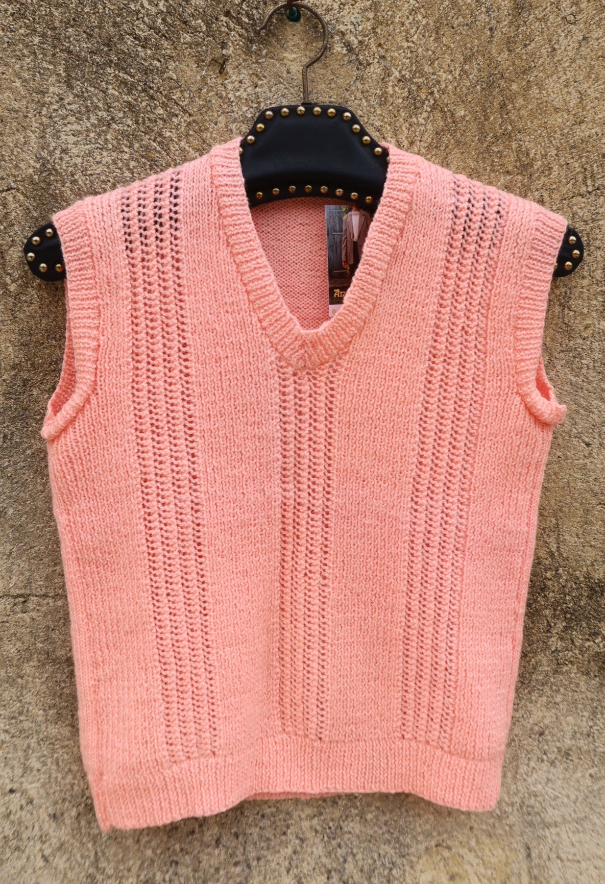 Pull sans manche rose bonbon tricoté